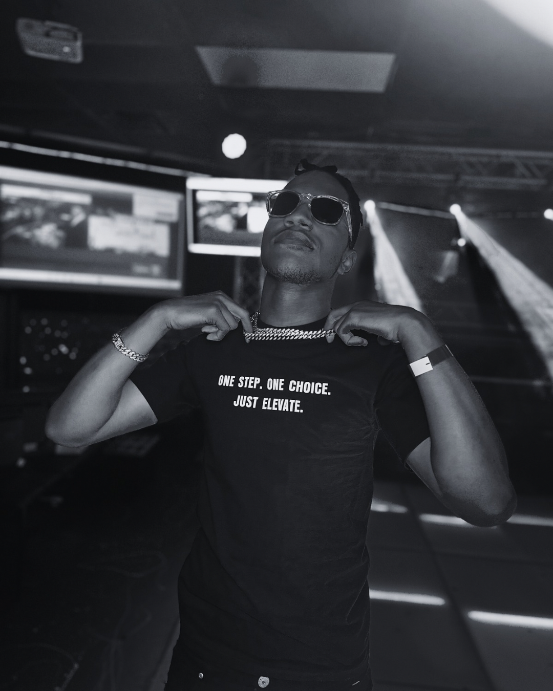 Model wearing the Elevate Code t-shirt with the slogan "One Step. One Choice. Just Elevate." A bold, motivational streetwear piece promoting intentional living.
